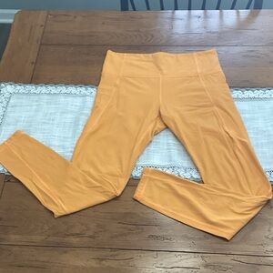 Athleta Orange Stash Pocket Leggings